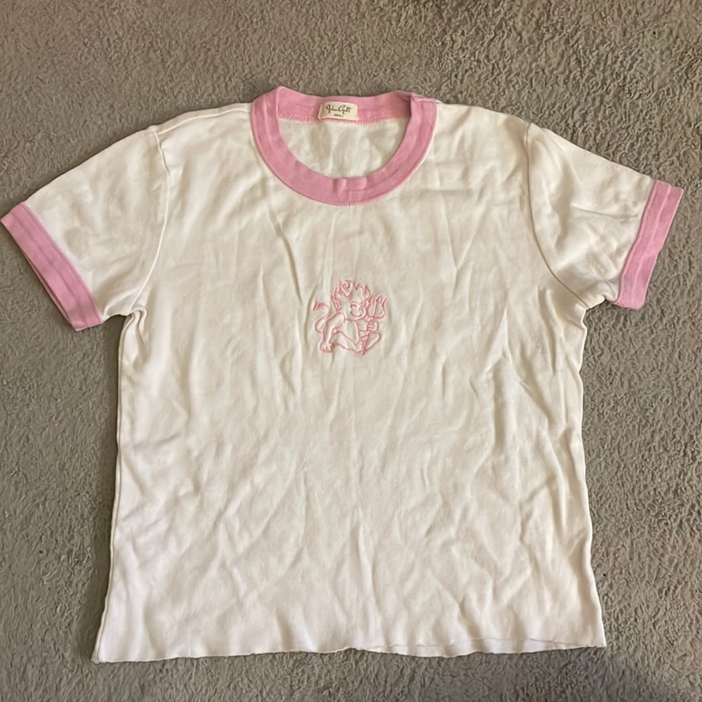 John Galt baby tee. White and pink. Embroidered baby devil.